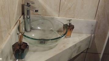 Shower, hair dryer, towels, toilet paper