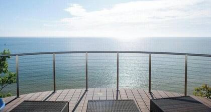 Lake Michigan home with beautiful beach frontage accessible from back yard.