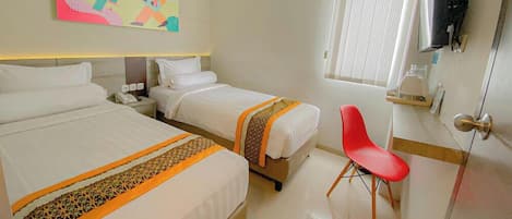 Premium bedding, desk, laptop workspace, free WiFi