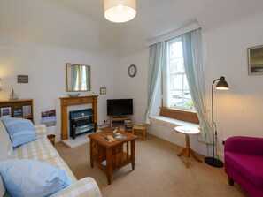 Apartment, 1 Queen Bed | Living room | 30-inch TV with cable channels