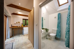 A modern bathroom with a shower, toilet, and sink. - The Smokehouse, Ingoldisthorpe, Norfolk (Ingoldisthorpe)