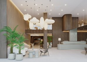 Un vestíbulo moderno con mostrador de recepción, zona de estar y una escalera.
