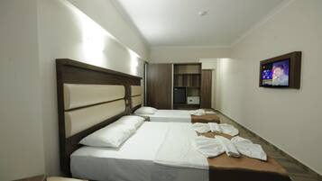 Standard Triple Room, Non Smoking | Minibar, laptop workspace, free WiFi, bed sheets