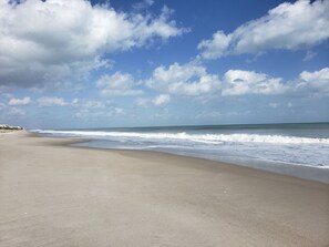 On the beach, sun loungers, beach towels