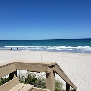 On the beach, sun loungers, beach towels