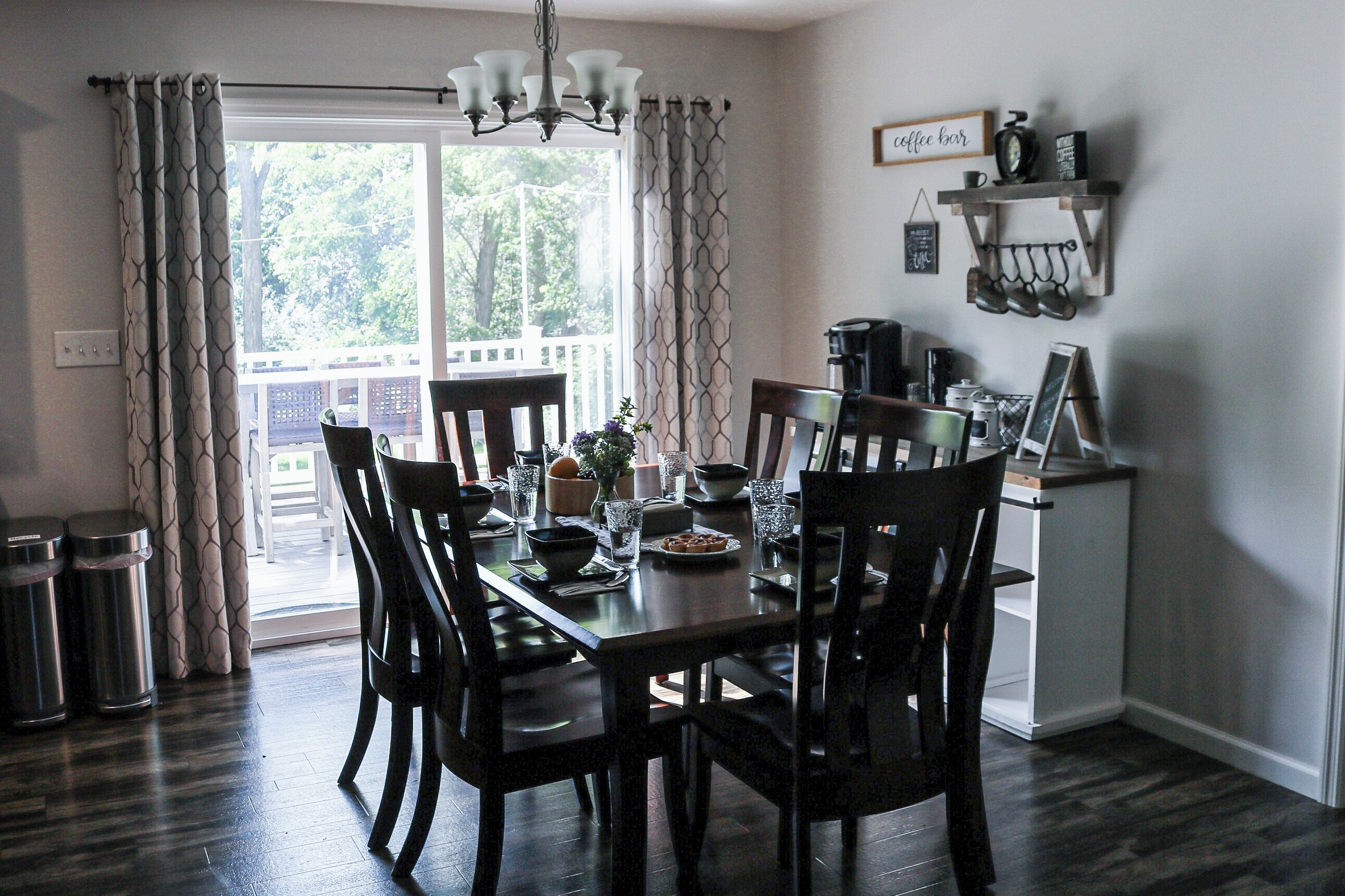 Dining table seating six with extra folding chairs available.