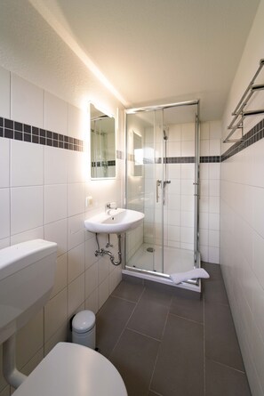 Shower, towels, soap, toilet paper