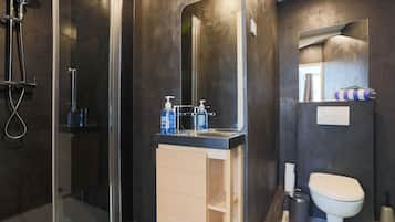 Shower, towels, soap, toilet paper