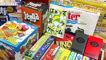 A variety of colorful boxes, likely containing toys or games, with Japanese text.