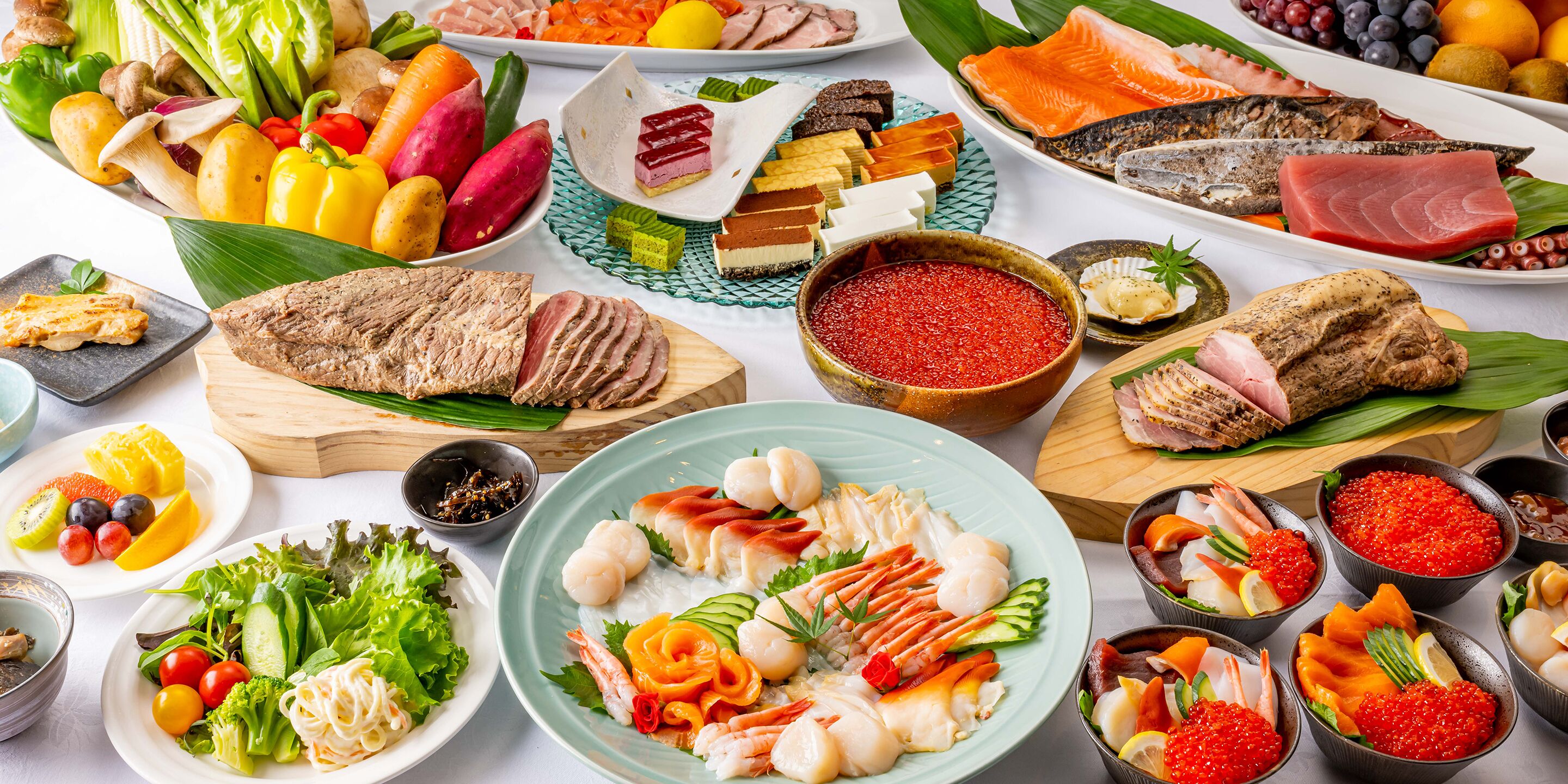 A variety of food items including seafood, vegetables, and meats arranged on a table.