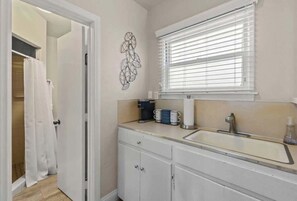 Shower, hair dryer, towels, shampoo