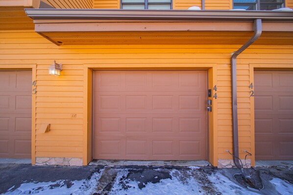A garage door with the number 45 on the left and 42 on the right.
