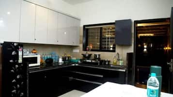 Fridge, microwave, cookware/dishes/utensils, spices