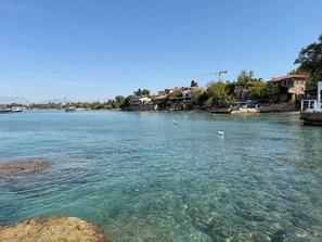 A coastal town with clear waters, boats, and buildings along the shore. - Carpe Diem Boutique Hotel - Adults Only (Manavgat)