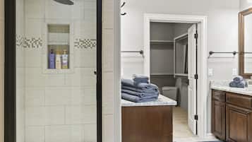 Combined shower/bathtub, hair dryer, towels, soap