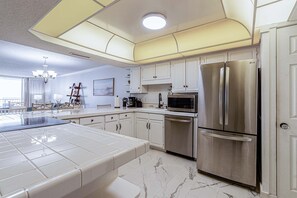 Fridge, microwave, oven, stovetop - Beachfront Condo in the heart of Destin! FREE BEACH SERVICE. (Destin)