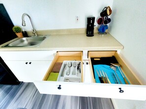Fridge, microwave, stovetop, coffee/tea maker