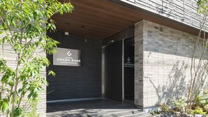 A hotel entrance with a sign for 'Hotel Grand Base'. - GRAND BASE Saiwaimachi (Nagasaki)