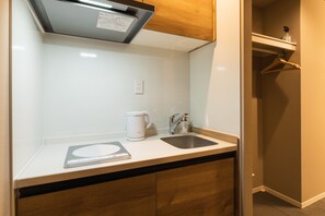 Standard Room, Non Smoking (A) | Private kitchen | Full-sized fridge, microwave, stovetop, electric kettle - GRAND BASE Saiwaimachi (Nagasaki)