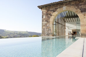 Indoor pool, outdoor pool, pool umbrellas, pool loungers