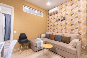 Apartamento | Área de estar | TV LCD, filmes recentes, filmes pagos, serviços de streaming