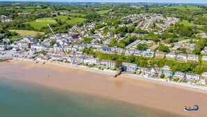 An aerial view of a coastal town with a beach house labeled. - Kilmore - Beach Front House Direct Beach Access Spectacular Sea Views (Saundersfoot)