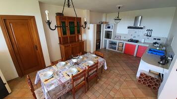 Standard Villa | Private kitchen | Dining tables