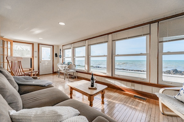 Airy sunroom with expansive windows capturing the incredible views of Lake Erie