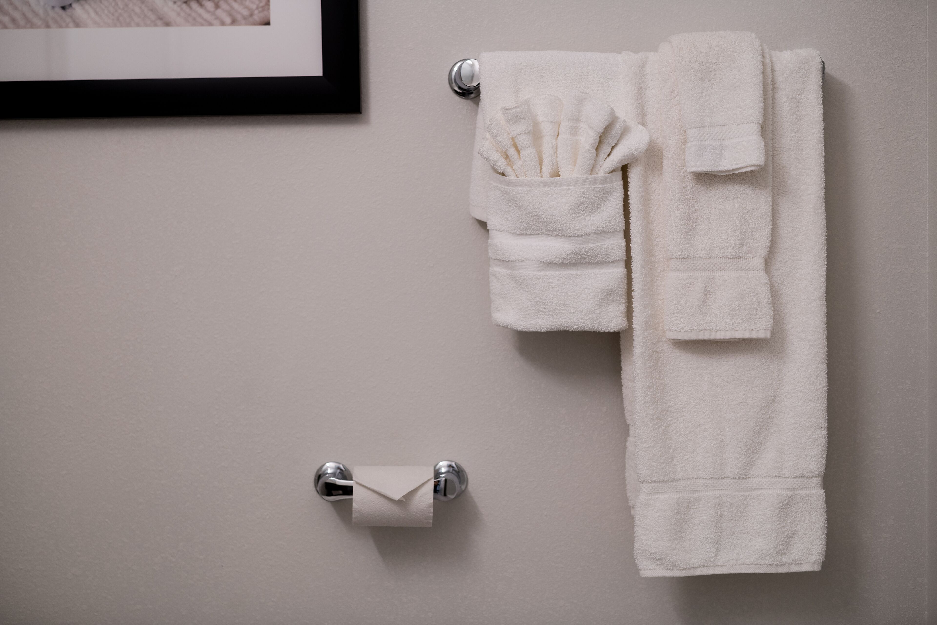 rainfall showerhead, hair dryer, towels, soap