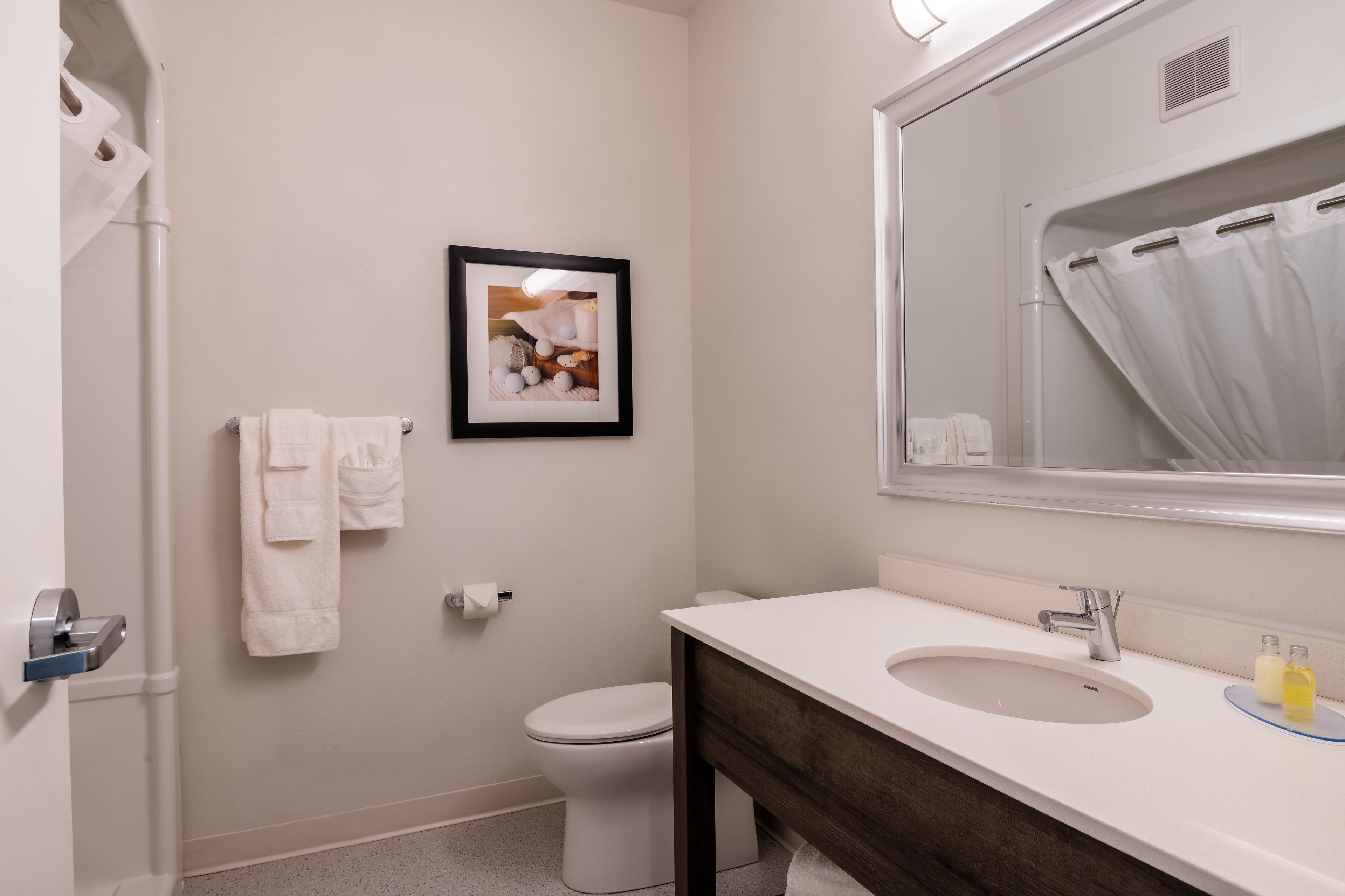 rainfall showerhead, hair dryer, towels, soap