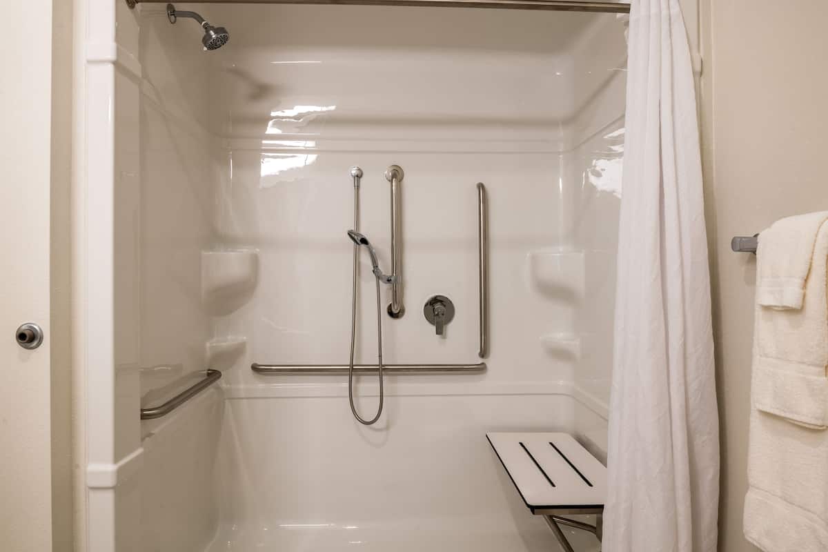 rainfall showerhead, hair dryer, towels, soap
