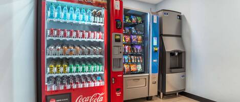 A vending area with Coca-Cola and other beverage machines, including a water dispenser.