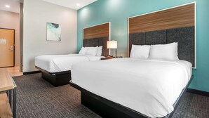 A hotel room with two beds, a desk, and a door. - Comfort Inn Miramar Beach-Destin (Miramar Beach)