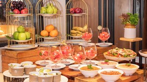 A buffet with various food items and fruit displays. - Fairfield by Marriott Goa Benaulim (Benaulim)