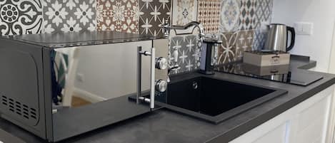 Fridge, microwave, stovetop, coffee/tea maker