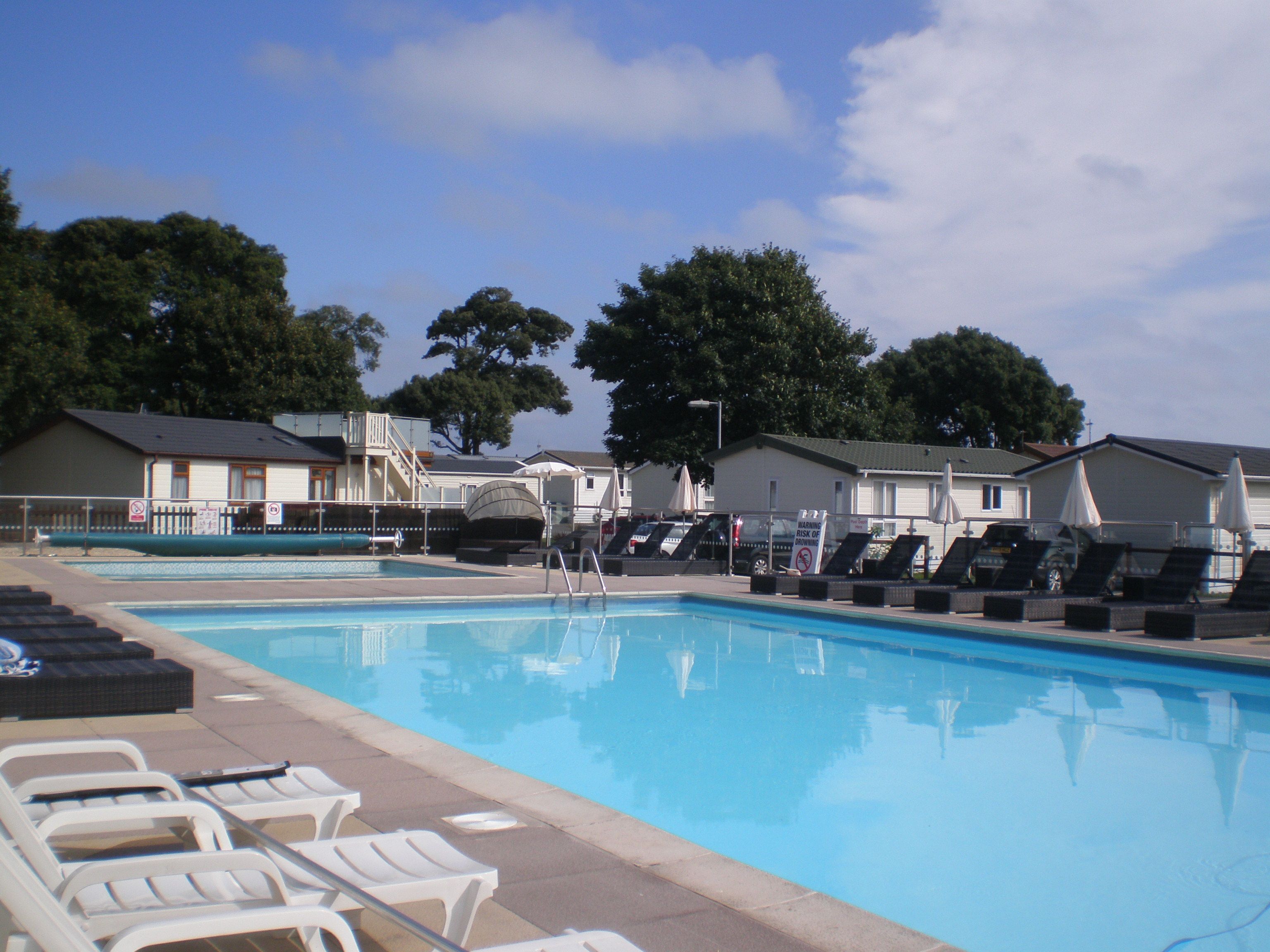 A heated pool, sun loungers