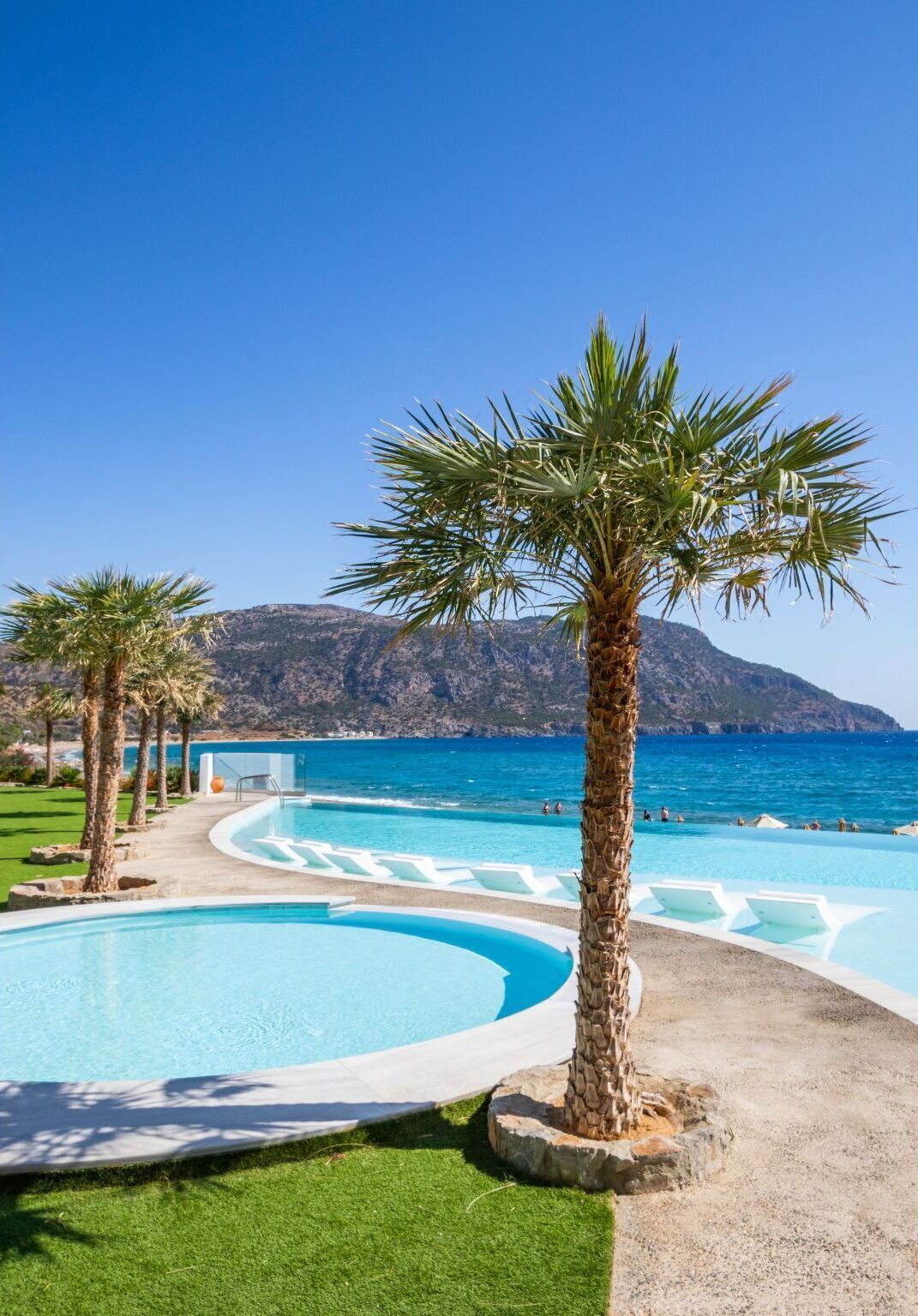 Seasonal outdoor pool, open 9:00 AM to 7:00 PM, pool umbrellas