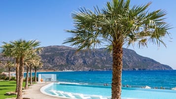 Seasonal outdoor pool, open 9:00 AM to 7:00 PM, pool umbrellas