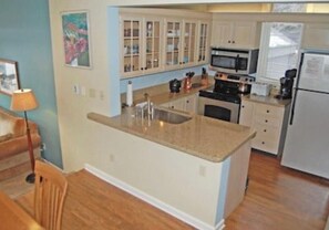 Microwave, dishwasher, coffee/tea maker, cookware/dishes/utensils