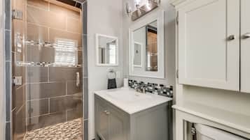 Bathtub, hair dryer, towels, soap