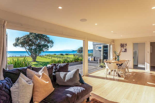 Open plan living and dining onto large Deck with seaview