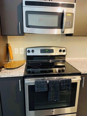 Microwave, dishwasher, coffee/tea maker, cookware/dishes/utensils