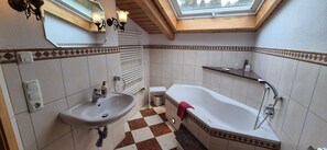 Bathtub, hair dryer, towels