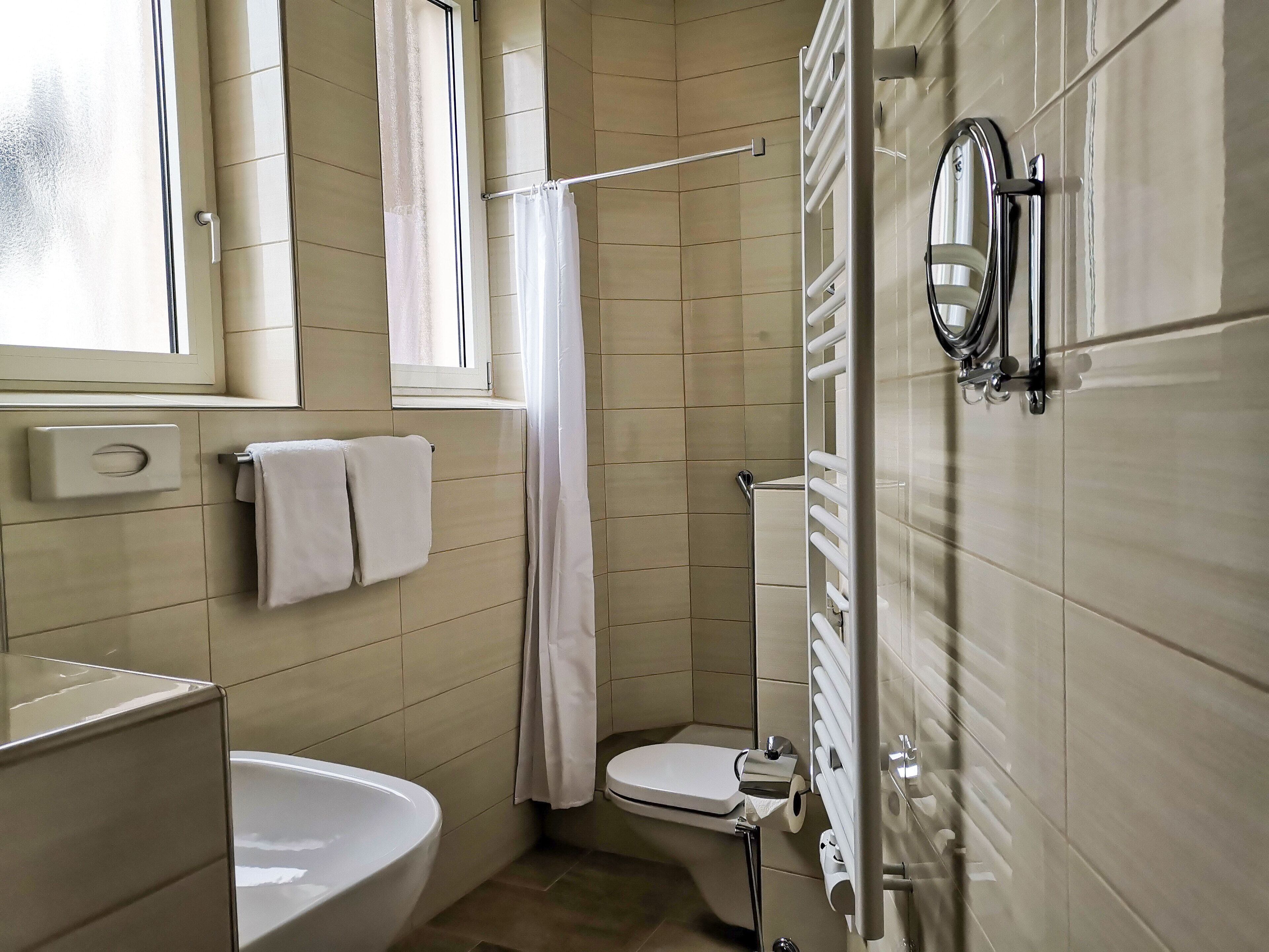 comfort single room | bathroom | hair dryer, towels