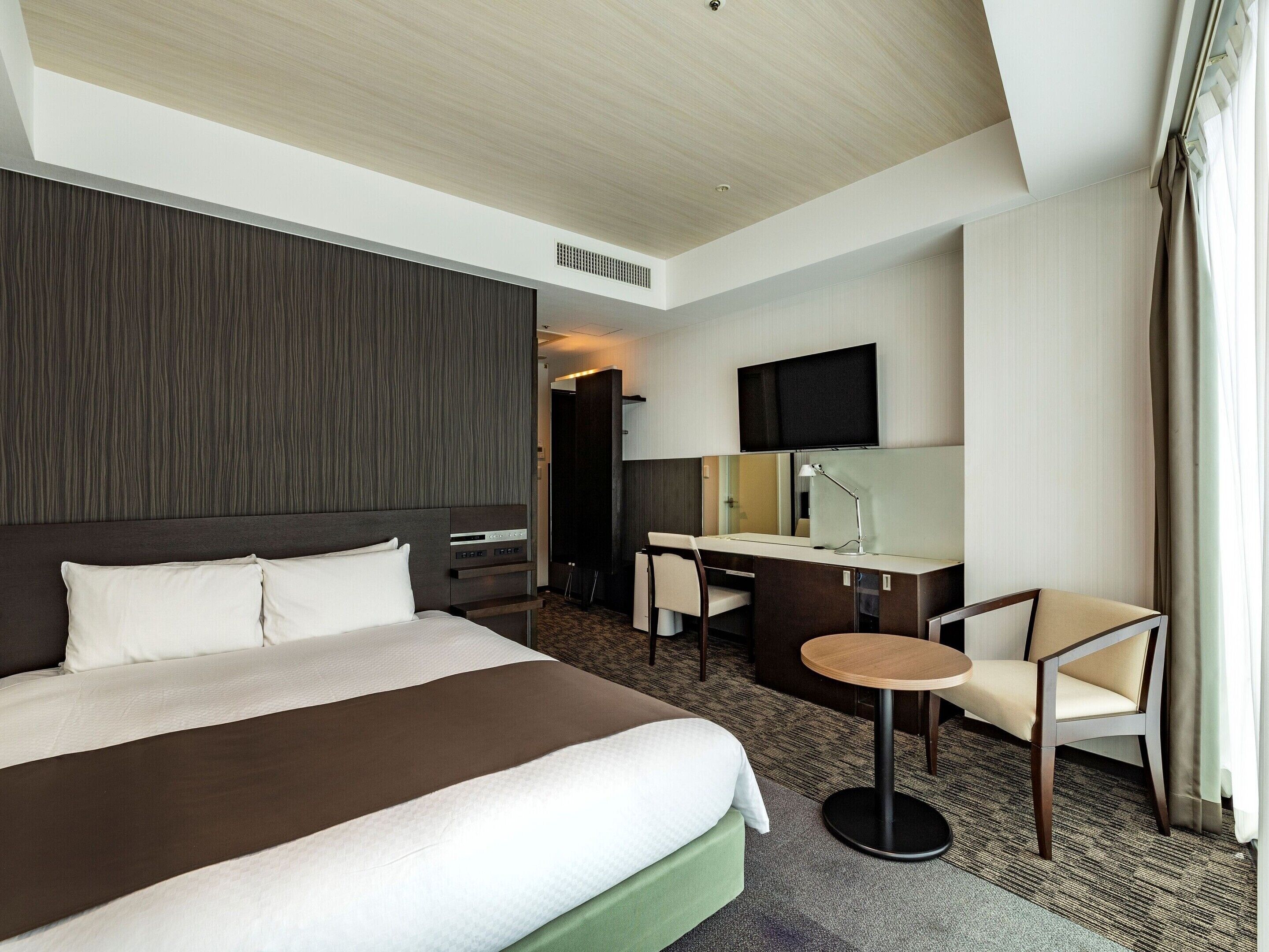 Down duvets, desk, laptop workspace, blackout curtains