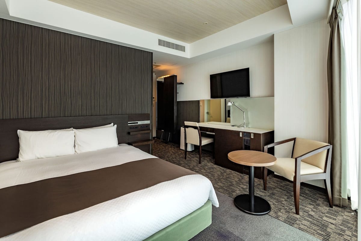 Down comforters, desk, laptop workspace, blackout drapes