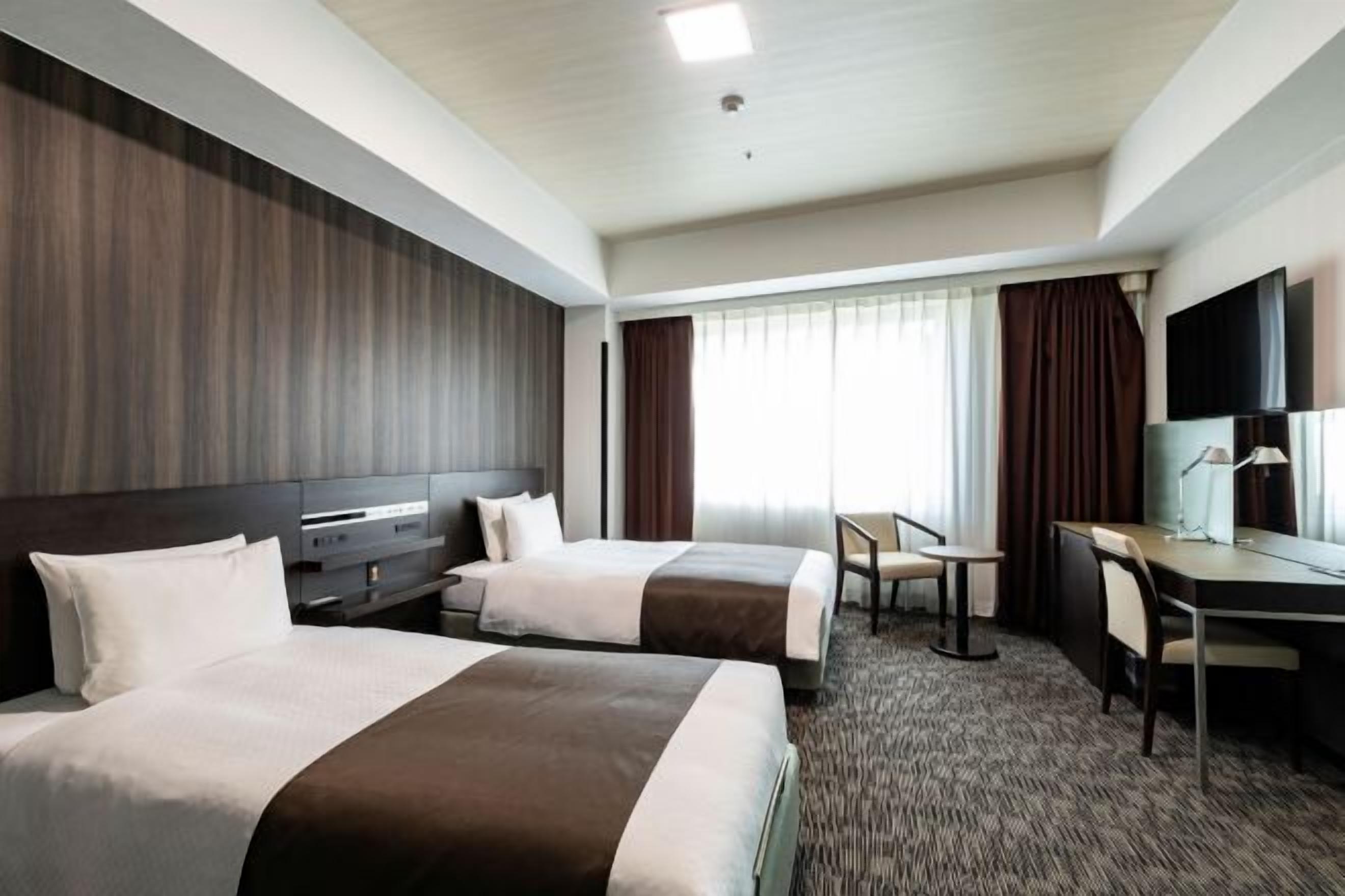 Down duvets, desk, laptop workspace, blackout curtains