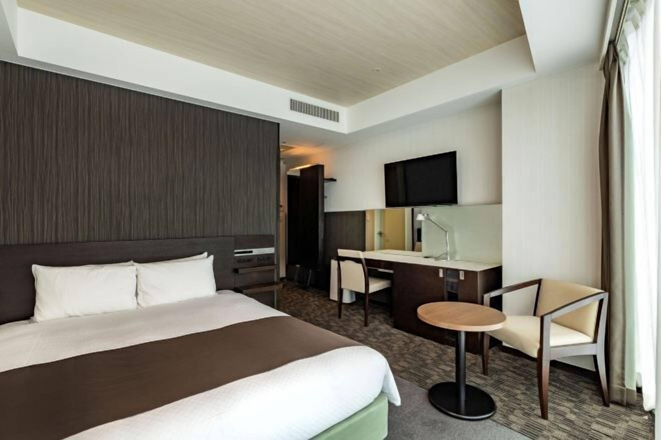 Down duvets, desk, laptop workspace, blackout curtains