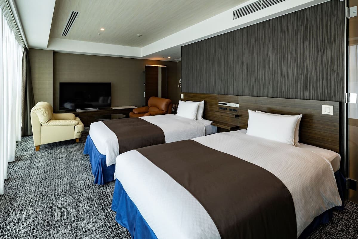 Deluxe Twin Room - Non-Smoking | Down comforters, desk, laptop workspace, blackout drapes