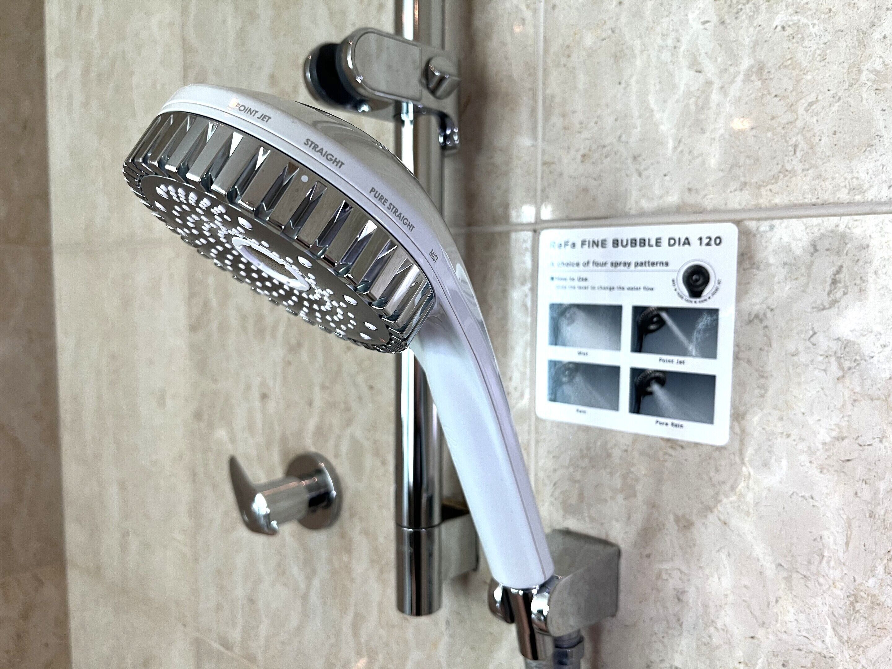 combined shower/bathtub, hair dryer, slippers, electronic bidet